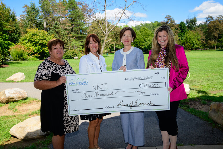 The Scranton Area Community Foundation presented a check for $10,000 to the Northeast Regional Cancer Institute. Pictured are Cathy Fitzpatrick, left; Laura Toole; Karen Saunders; and Laura Ducceschi.