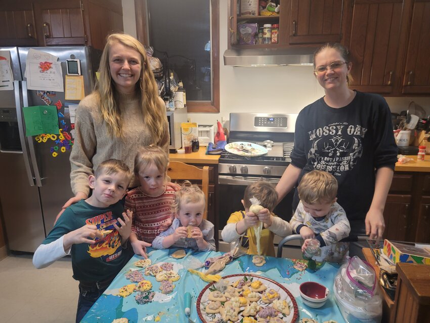Our cookie decorating squad makes short work of a few dozen blank cookies.