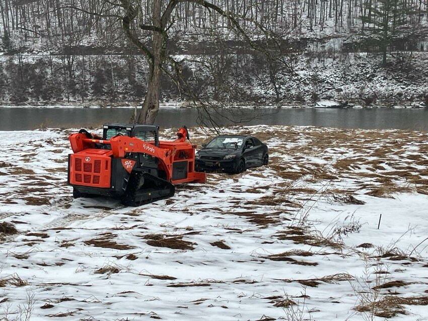 Prestige Towing's skid-steer with the Upper Delaware's most famous sedan.