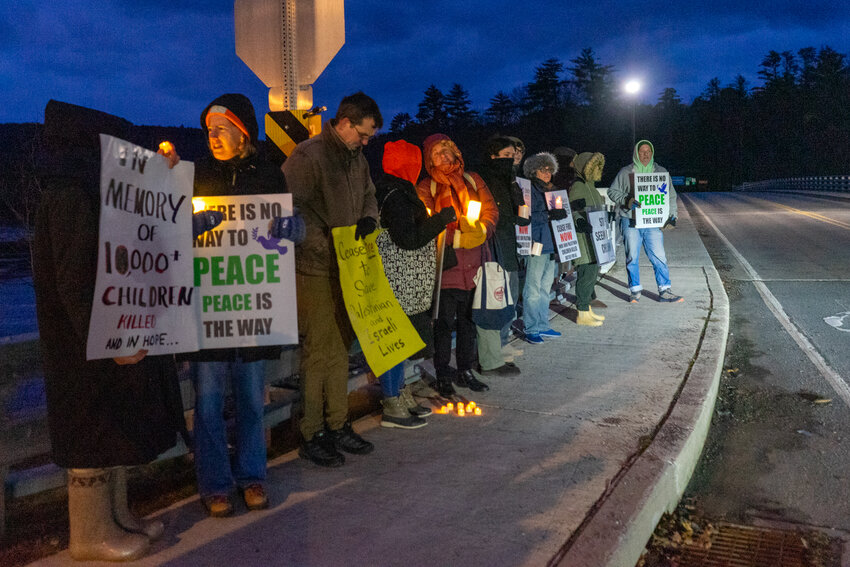 Members of the community gather on the Narrowsburg Bridge, calling for peace in Israel.