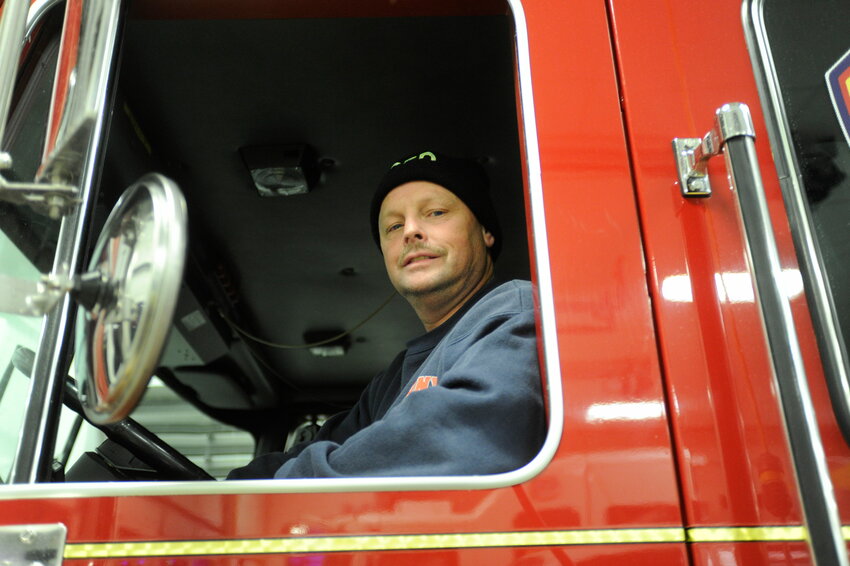 Willy &quot;Ladder Truck&quot; Maxwell, chief of the Callicoon Volunteer Fire Department, at the wheel of their tower ladder apparatus