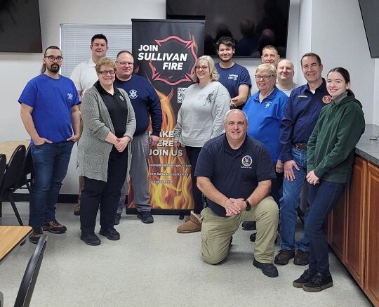 Participants included, standing from the left, Woodbourne FD Chief James Tavormina, Workforce Solutions Trainer Zachary Hottel, Workforce Solutions Trainer Jill Holland, Sullivan County 911 and EMS Coordinator Alex Rau, Lake Huntington FD Commissioner/Firefighter Jenna Sayers, Woodbourne FD Captain Jesse Payne, Neversink FD EMS Captain Ann Bivins, Lehigh County (PA) Emergency Management Agency Special Operations Coordinator Kevin Krotzer, Loch Sheldrake FD Firefighter Arron Wizwer, Workforce Solutions Trainer Chis Barron, and Kauneonga Lake FD Firefighter Nicole Blais; and kneeling, Sullivan County Deputy Public Safety Commissioner and Fire Coordinator John Hauschild.