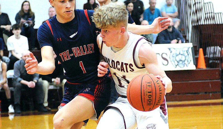 Cutting the line. Manor&rsquo;s Aiden Johnson edges past Tri-Valley defender Misha Kodakovski. He received the Most Valuable Player Award in varsity boys&rsquo; basketball for 2023-2024.