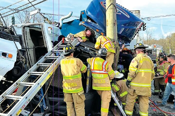 Published in the Sullivan County Democrat, this photo shows firefighters rescuing a truck driver after an accident at the Wurtsboro four corners on April 11, 2023.