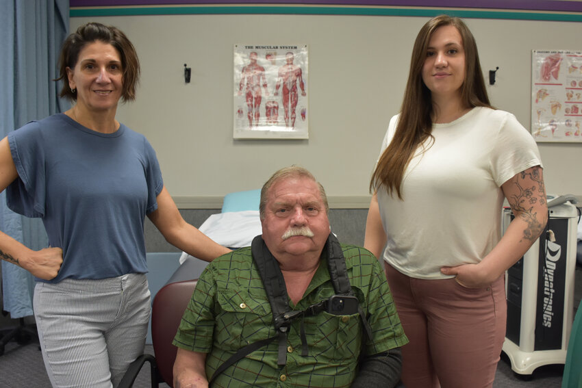 Saving a life. A timely appointment and alert physical therapists saved Ted Moser&rsquo;s life. Pictured are Physical therapy assistant Michelle Marcho, left; Moser; and physical therapy assistant Sarah Langendoerfer...