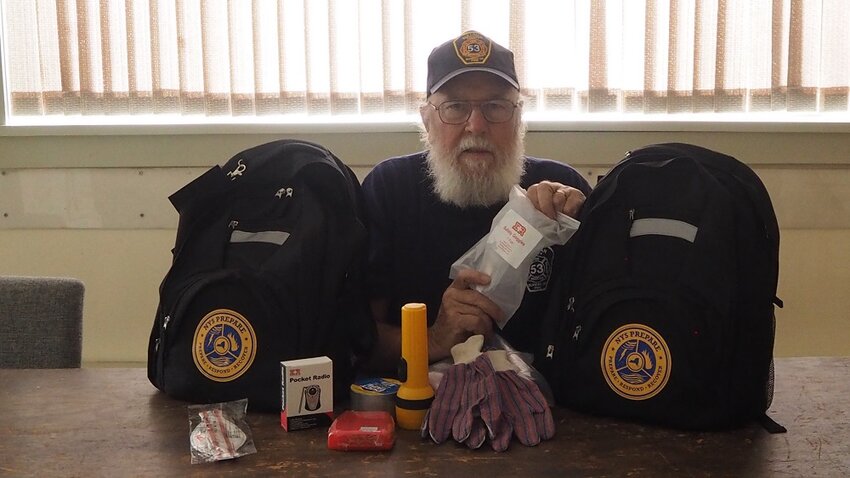 Jack Halchak, Chief Deputy Fire Coordinator for the Sullivan County Bureau of Fire, takes inventory of the to-go bags handed out to all participants of the citizen preparedness class.