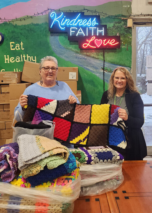 Sullivan County Retired Senior Volunteer Program (RSVP) coordinator Monika Roosa, pictured right, delivers some blankets&mdash;made by RSVP volunteers&mdash;to Sullivan County Federation for the Homeless executive director Kathy Kreiter.
