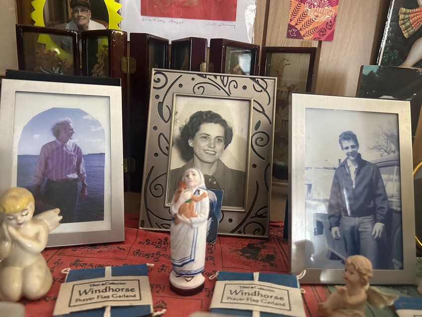 The shelf of memories at Sheila Dugan's home
