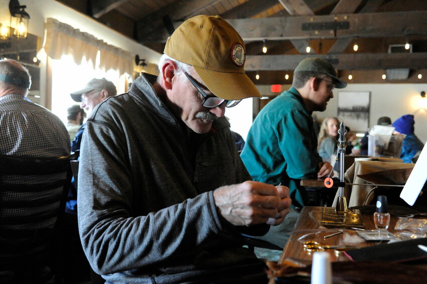 John Apgar of Andover, NJ, a member of the Catskill Fly Tyers Guild, is pictured creating a dry fly.