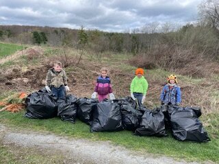 The Tri-Gal Cloverbud trash collection at the Hillcrest Cemetery in Galilee, PA. Pictured are Orville, left; Kelly Ann; Henry; and Jade.