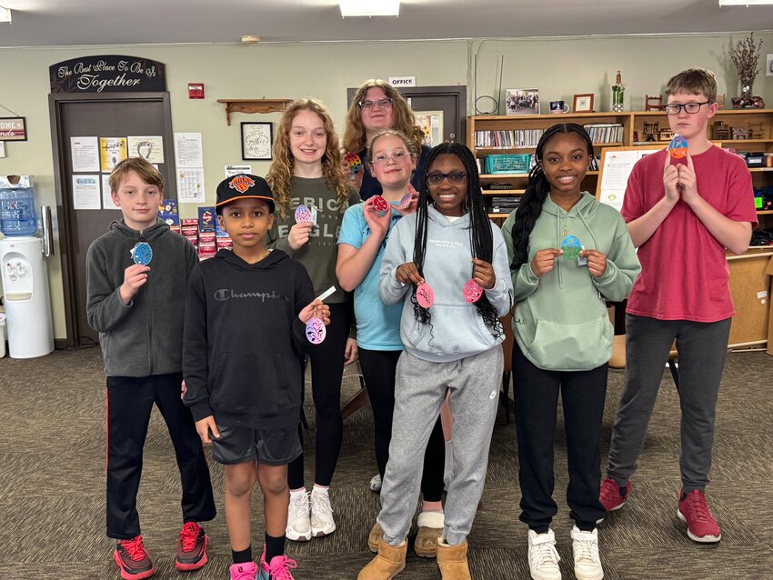 Making Easter eggs for the senior center. Pictured are, in the front row, Rudy Bolling, left; Kylie Bolling; and Madison Bolling. In the second row: Max Seder, left; Makenna Seder; and Shawn Lineline. In the third row: Addison Polak, left, and Victoria Polak.