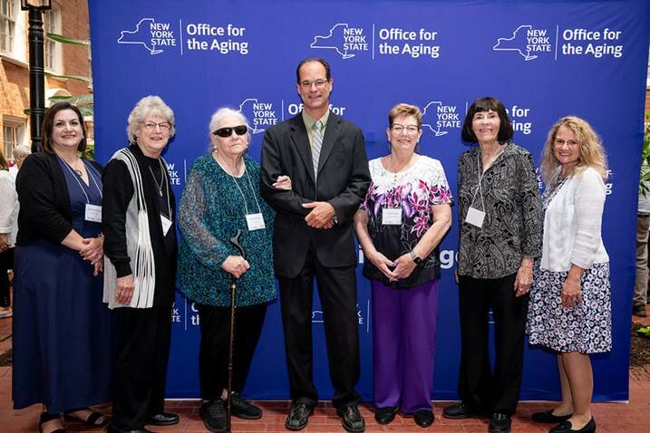 Celebrating Older New Yorkers Day with close to 100 others in Albany were, from the left, Sullivan  County Office for the Aging Director Lise-Anne Deoul, Debbie Bradley, 2025 awardee Sabina Toomey, NYS Office for the Aging Director Greg Olsen, 2025 awardee Gayle Irving, Karin Pantel and Sullivan Volunteers Coordinator Monika Roosa.