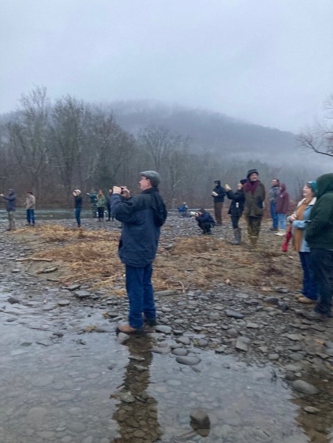 Well wishers and fishing enthusiasts line up to watch and  photograph the ceremonial “first cast” at Junction Pool, Roscoe, at 7:00 am on Saturday morning, April 1.