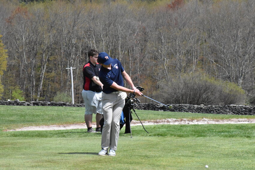 Gavin Clarke chips onto the green during a divisional matchup.