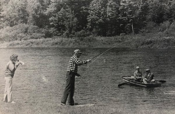 With Tournament Director Joan Wulff offering words of advice, Ricker Winsor of Neversink tries to hit the target during the Bass Bug Accuracy portion of the 2nd annual Casting Tournament, sponsored and held Sunday at the Catskill Fly Fishing Center in Livingston Manor. At right, George Holz of New York City tries to maintain his control as he battles a fierce wind during the day's events.