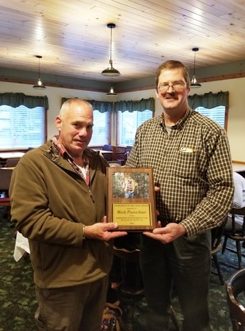 Vice President of the Sportsmen's Federation John VanEtten (right) presents the &quot;Sportsman of the Year&quot; plaque to Mark Puerschner.