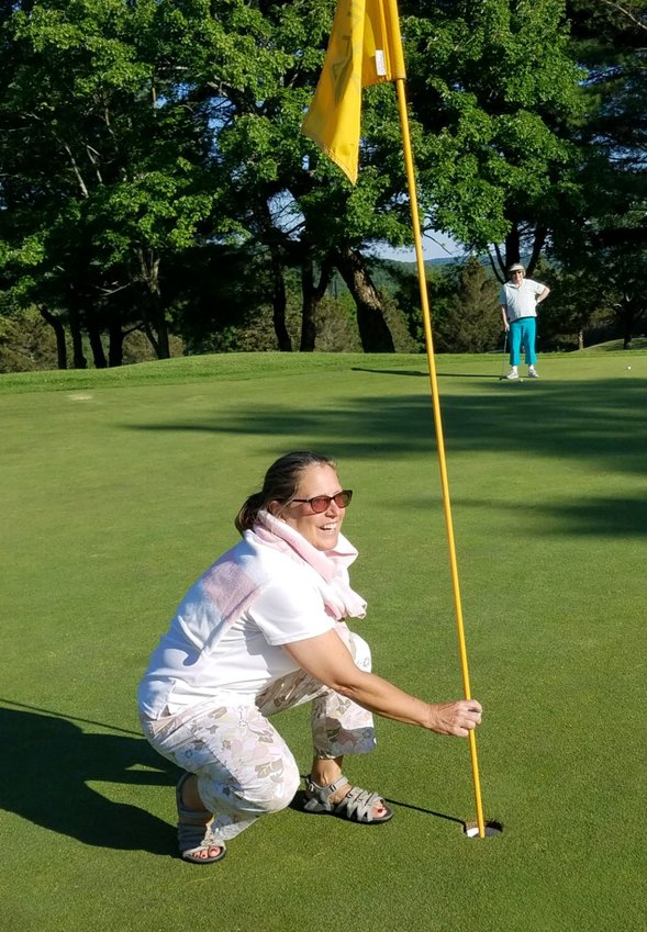 Cindy Menges celebrates her golfing milestone.