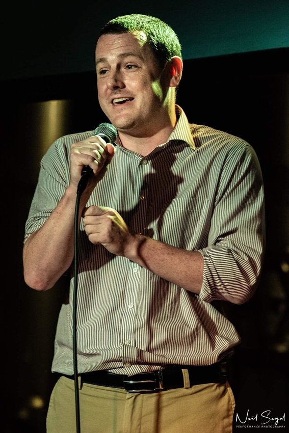 Michael performing stand-up comedy.