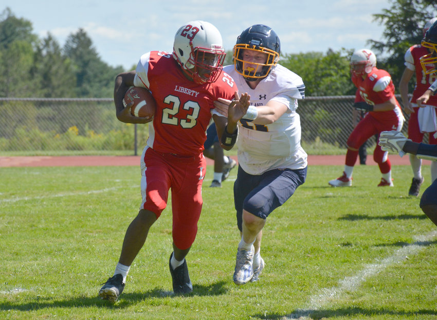 Liberty&rsquo;s Giovanni Dudley evades a Highland defender. The Indians fell to the Huskies, 32-6, in their season opener last Saturday. Liberty Coach Adam Lake said despite the loss, several positives came from the game. To read the full story about the game, visit scdemocratonline.com.