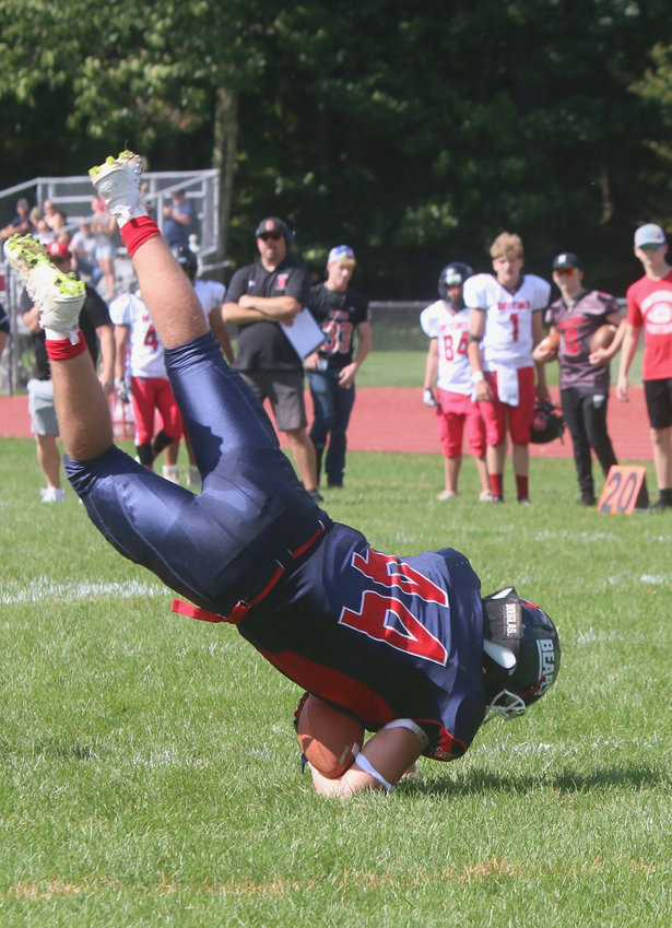 T-V Senior Dylan Poley flips his way into the endzone for one of his two TD&rsquo;s on the day. Poley is also a monster on defense with relentless pursuit and bone-rattling tackles.