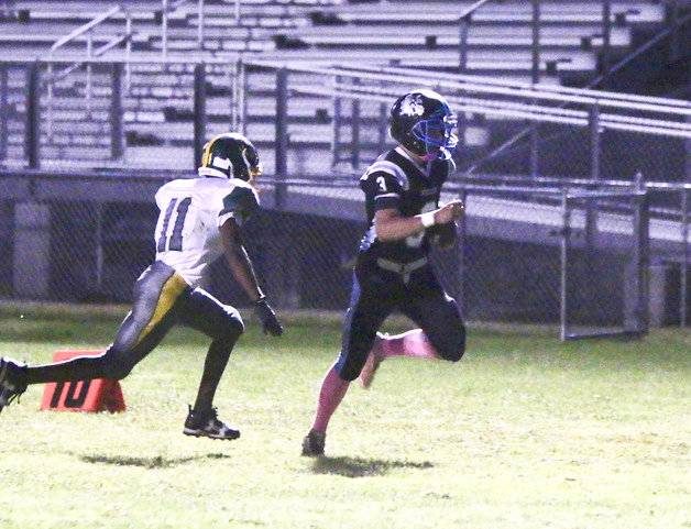 Sullivan West Justin Grund outruns and then eludes a tackle by Eldred&rsquo;s John Darby to score the first of his two touchdowns on the night. He added four conversion points as well showing his emergence as a kicker.