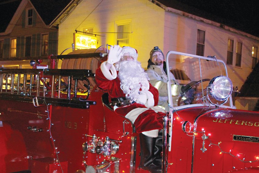 Santa Claus appeared in person onboard one of the Jeffersonville Fire Department&rsquo;s antique engines.
