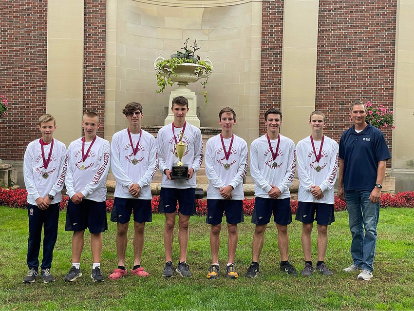 The state championship Tri-Valley Bears, along with their coach Chip Furman stand proudly holding the medals and trophy from the Burnt Hills Invitational, a forerunner to their success as state champions.   Pictured from left to right: Van Furman, Thomas Houghtaling, Caleb Edwards, Adam Furman, Vincent Mingo, Connor Weyant, Craig Costa and Coach Chip Furman.