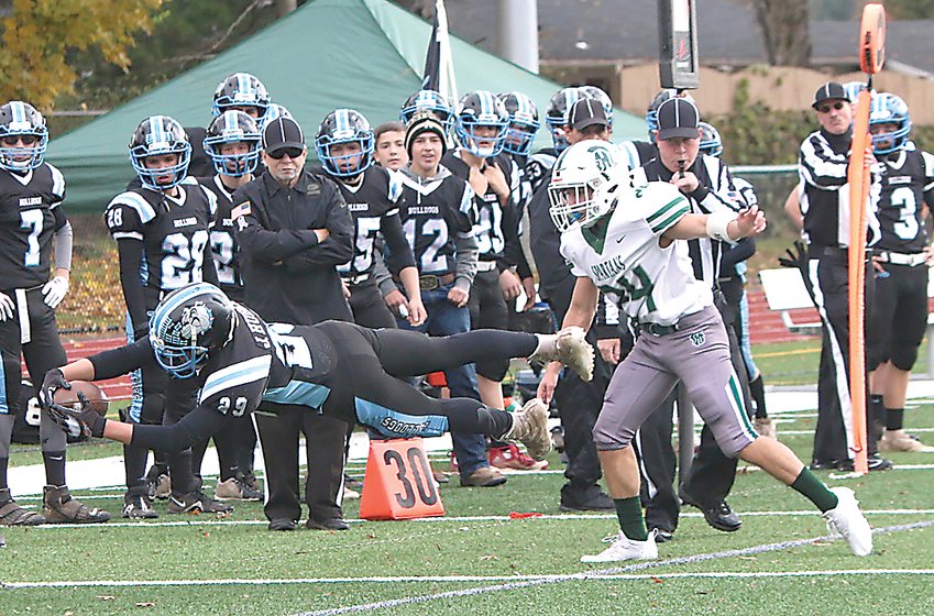 Sophomore Jacob Hubert makes a great diving catch on a pass from quarterback Gavin Hauschild early in the 8-Man Championship Game. The Bulldogs played hard but ultimately came up short against Spackenkill after defeating the defending champs, Pawling, in the semifinal round.