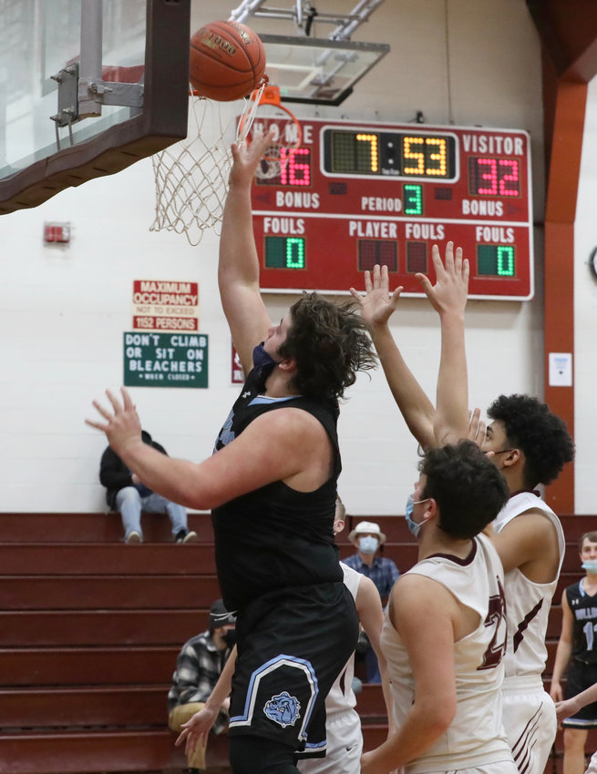Sullivan West&rsquo;s Chris Campanelli uses his size disparity to score two of his 11 points in this third quarter show of strength.