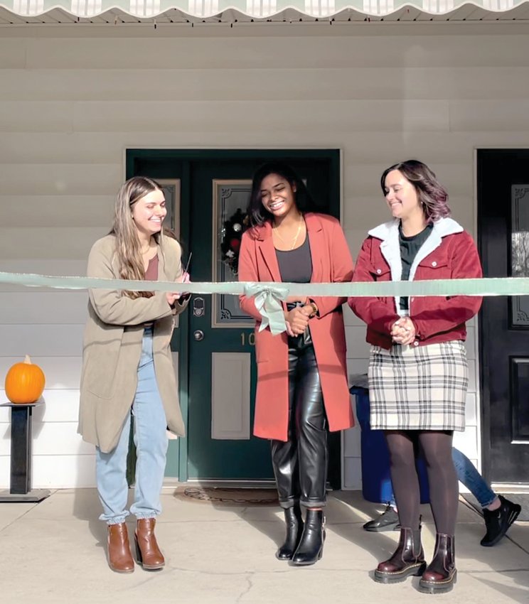 Friends (from left) Jessica Falco, Jamie DiLeo and Jasmine Hall celebrate the grand opening of The Garden on Dec 3.