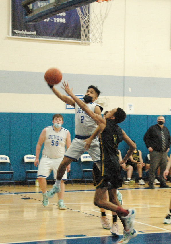 Eldred&rsquo;s eighth grade standout player Trai Kaufman, seen here guarding Roscoe senior Alaniz Ruiz, led all scorers with 18 points. Ruiz netted 9 for the Blue Devils in the 69-37 league victory.