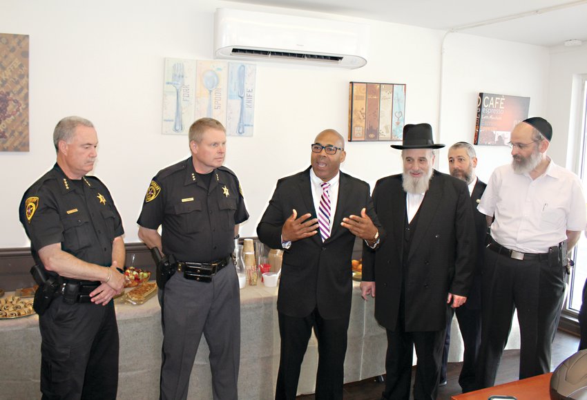 At right, Chief Williams speaks  during a &ldquo;Coffee with the Sheriff&rdquo; event in 2019.