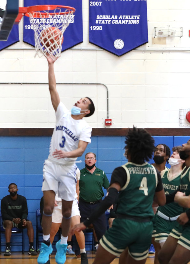 Monticello Captain Pedro Rodriguez does what he does best by slashing to the rim in the early going. But that was not a preview of coming attractions as the prolific guard only managed to score seven points in the sectional loss to FDR.