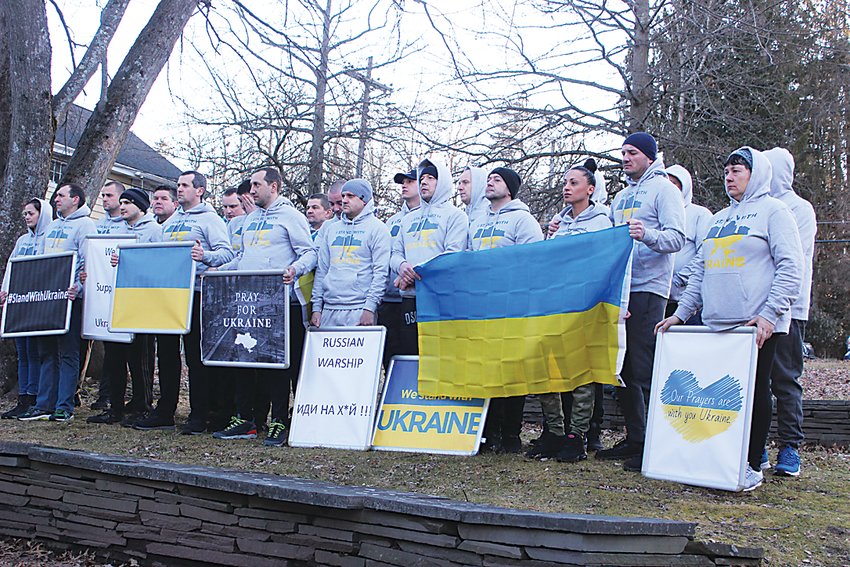 Ukrainian employees from Liberty Temp Services Inc. gathered at LaPolt Park where they held flags and displayed signs in support of the Ukrainian people.