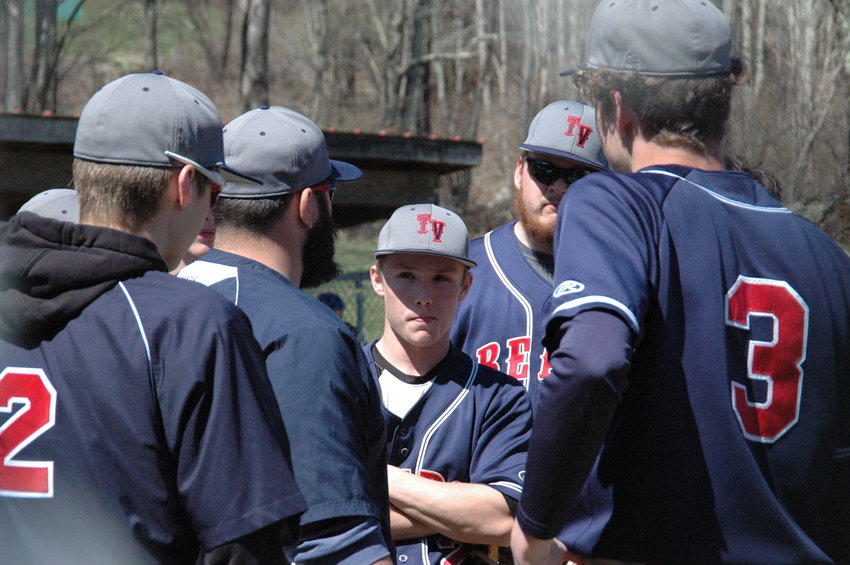 Coach Kevin Crudele meets with his team between innings to keep them motivated and focused. The Bears ended a four-game week on Friday against Chester, losing 21-7 in the league matchup.