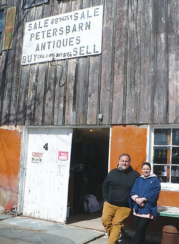 The landmark Peters Auction Barn in Jeffersonville has a new lease on life. Jeffersonville residents Davide Carbone and Elda Bellone, above, plan to restore the 1800s structure and open it to local businesses as well as their own.