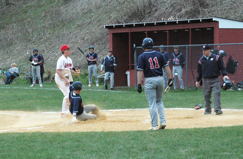 Tri-Valley&rsquo;s Austin Hartman slides safely into home after taking off on a passed ball. The Bears beat the Indians 7-5.