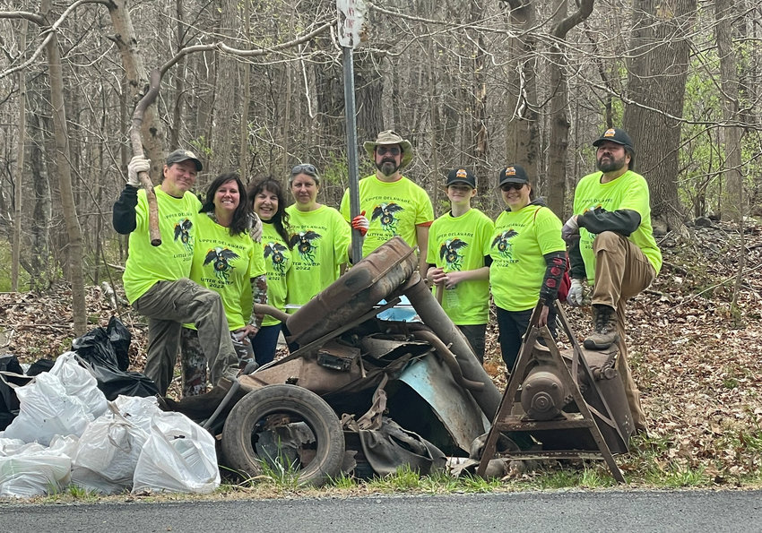 From left to right-Andy Russ, Susan Fraysse Russ, Liz Peterson, Jamie Macri, Austin Hand, Sadie Hand and Sarit Hand. During the Upper Delaware Council&rsquo;s Litter Pluck last weekend the amazing Dark Forest Creation Crew of volunteers from the Burn Brae Mansion in Glen Spey found loads of metal buckets, piles of tires, bottles, almost an entire car, a bumper with the license plate still attached and a rusted out Sears and Roebuck cement mixer and filled an additional twenty bags with trash. Andy Russ summed up all their hard trash collecting saying &ldquo;we are undoing the misdeeds of others.&rdquo;