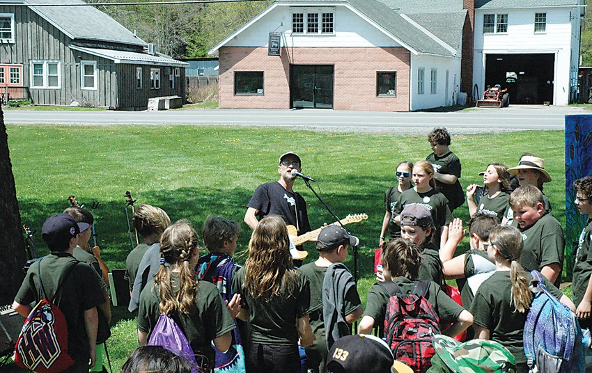 Environmental Folksinger and songwriter Ira McIntosh performed for the students after all the fish had been released.