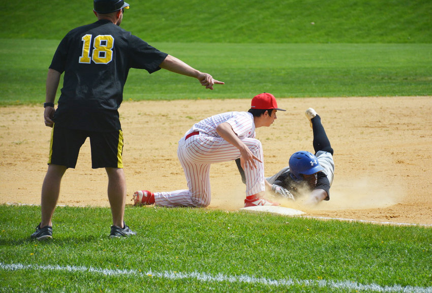 Fallsburg&rsquo;s Eugene Johnson blasted a ball into the outfield. While earning an RBI, he was tagged out in the nick of time going for a triple by Liberty&rsquo;s Cody Ricco.