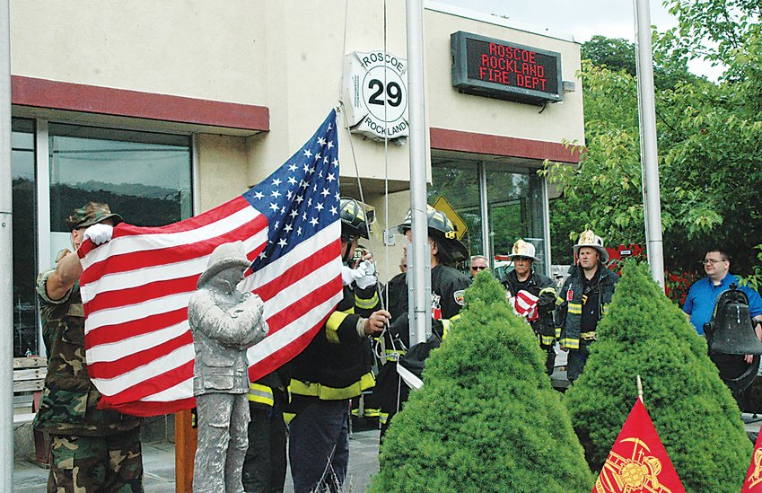 The Roscoe-Rockland Volunteer Fire Department honored the memory of those who lost their lives during the attacks on 9/11 with a recovered marble stone, a logbook, and the raising of the flag that once flew at Ground Zero with a ceremony outside the Firehouse.