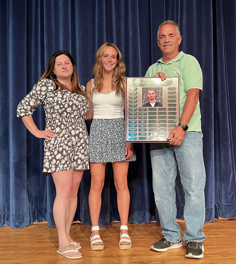 Grace Boyd receives this year's David Curreri scholarship from presenters Brenda Curreri and Joe Curreri. Boyd also was named as the Female MVP of the spring.