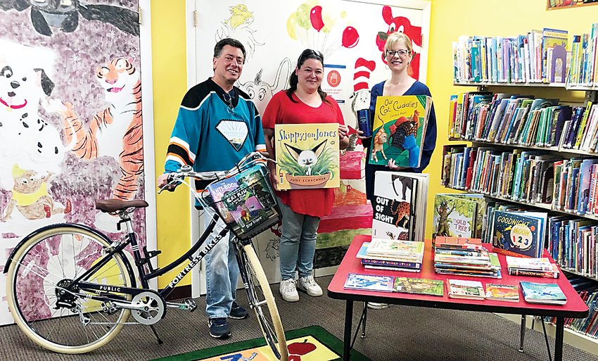 Fortress Bikes&rsquo; Hal Simon (left), Fallsburg Library&rsquo;s Amanda Letohic (center) and Hurleyville General Store&rsquo;s Denise Lombardi have teamed up on this new initiative.