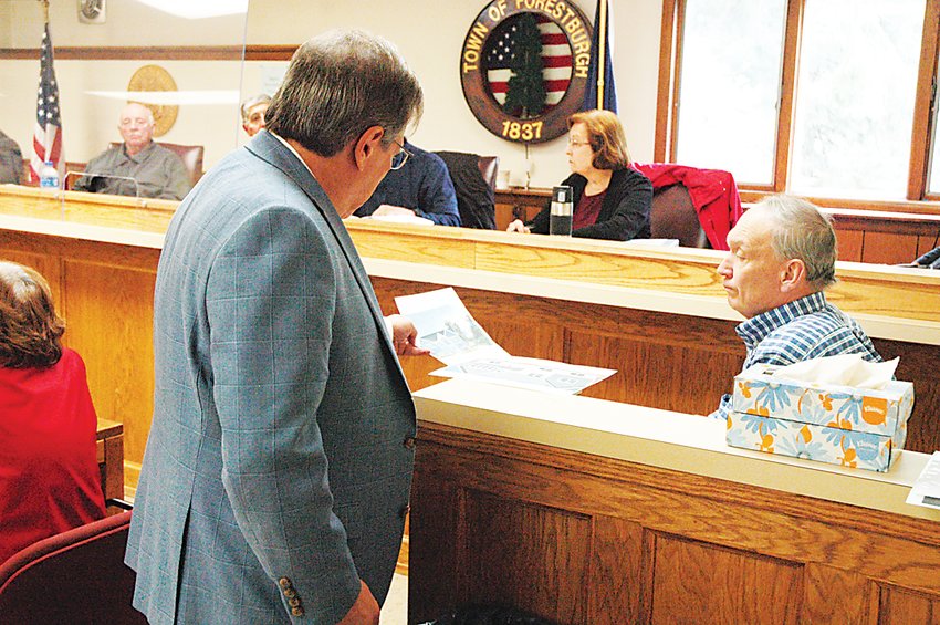 The cross examination of Building Inspector Glenn Gabbard, right, continued on June 23 as Lost Lake Holdings representative Steven Barshov displayed various documents and visuals before the Board.