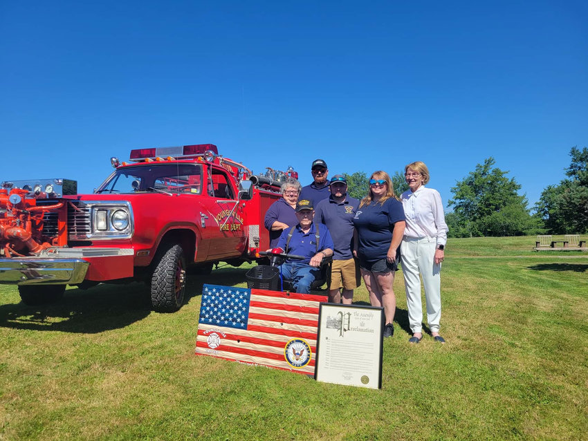 Woody McGibbon (sitting front), back row starting from left, wife Debra McGibbon, son-in-law Ben Creegan, son Jonathan McGibbon (also the president of fire department), daughter Amber Creegan and Assemblywoman Gunther.