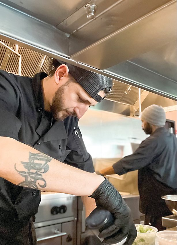 Jonathan Martinez (left) leads the kitchen at the Tango Caf&eacute;.