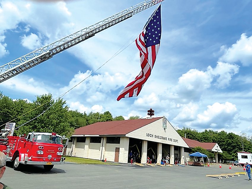 Terry Davis&rsquo; 1984 Mack Aerial Ladder Truck won first place in the Fire Truck category. While the body of the truck is not in the frame of this photo, its ladder can be seen proudly displaying the American Flag.
