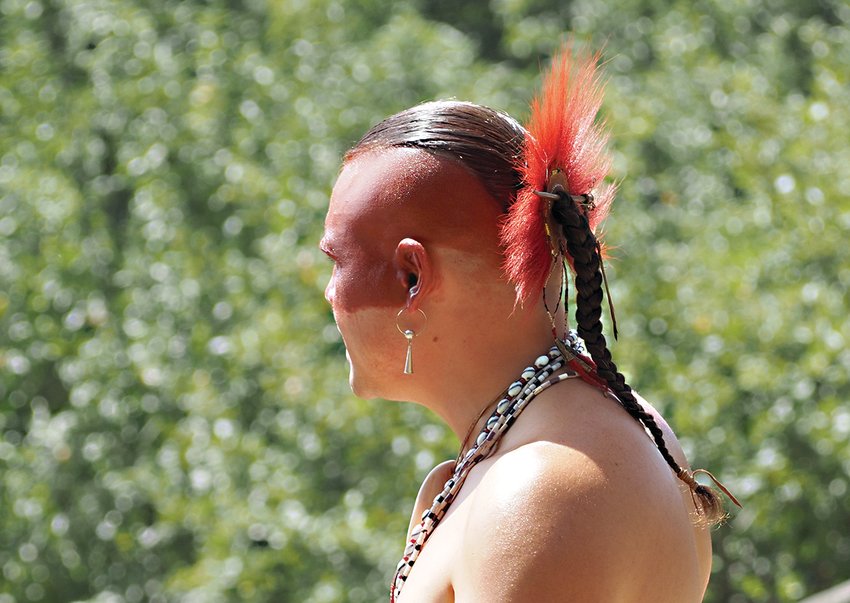 In Native culture, the color red symbolizes energy and health. Native men might have used dyed deer hair or feathers to decorate their hair.