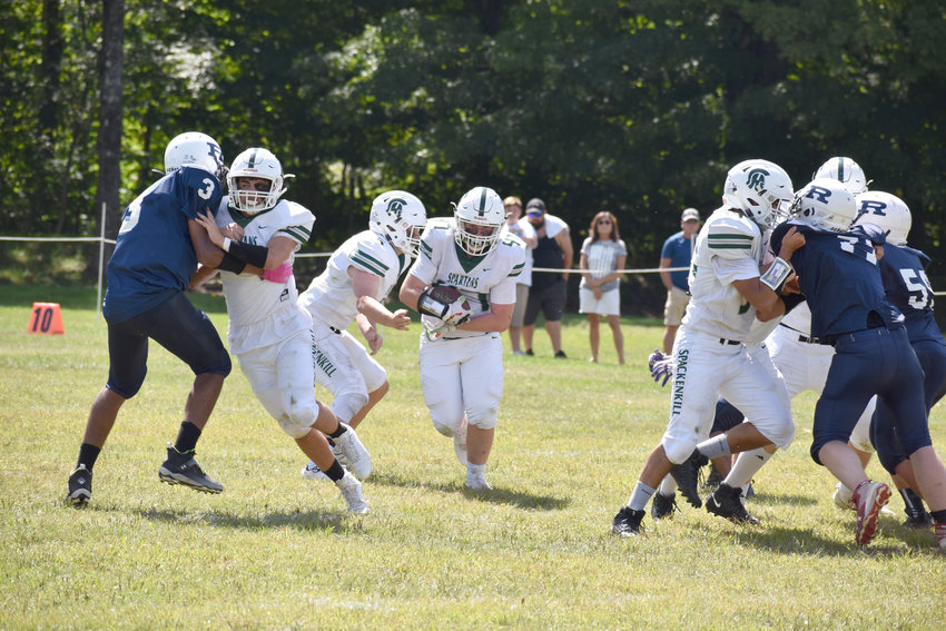 Spackenkill began with a steady dose of offense against the Blue Devils. Their linemen opened up a wide lane for a huge rushing gain.