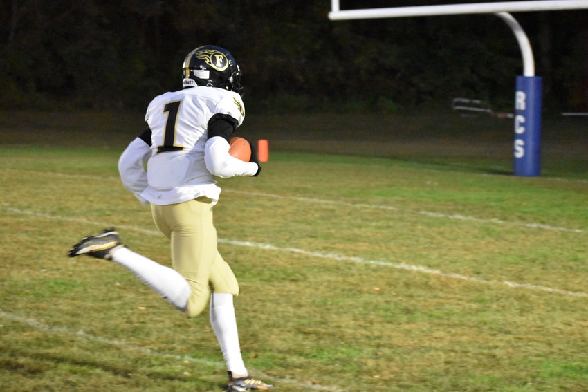 Isaiah Young trots into the end zone for a touchdown in the first quarter.